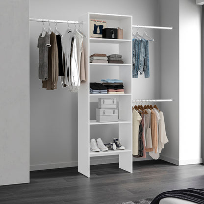 Closet with shelves and clothes hanging on a rack against a gray wall.