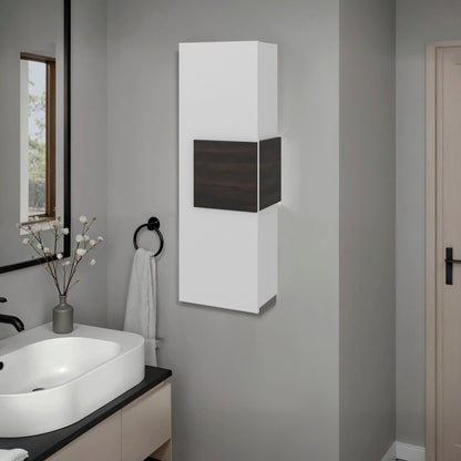 Bathroom with a white cabinet on a gray wall, sink, and mirror.