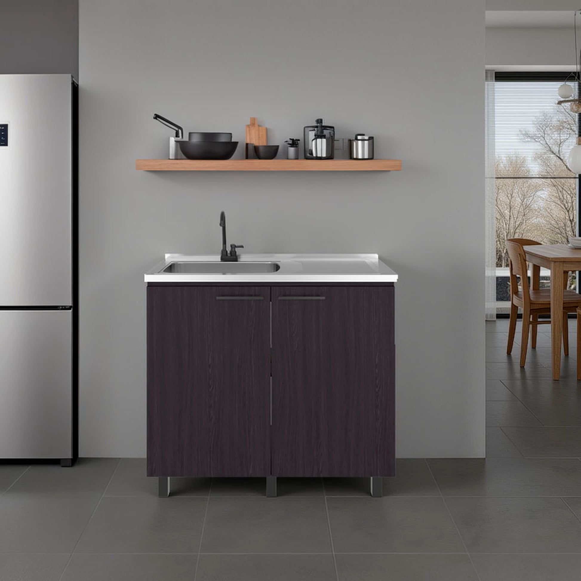 Modern kitchen setup with a stainless steel counter top, sink unit, and shelves.